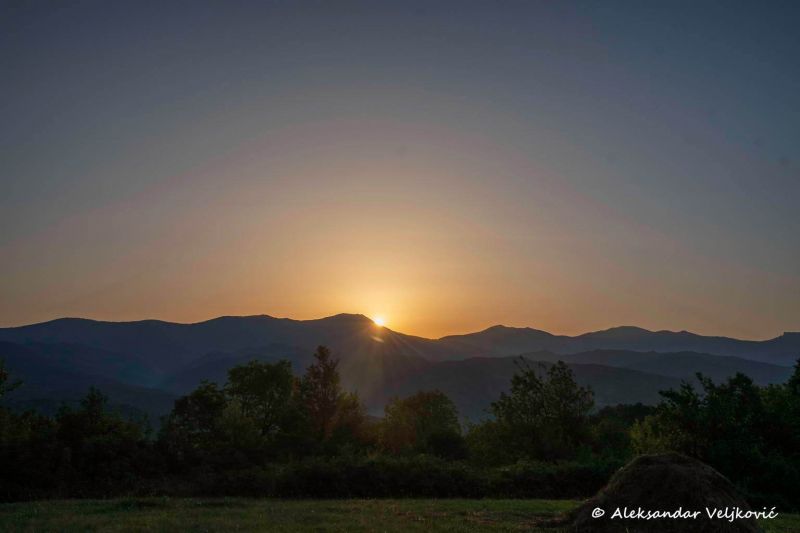 Sun rising behind Orlov kamen (Stara planina)